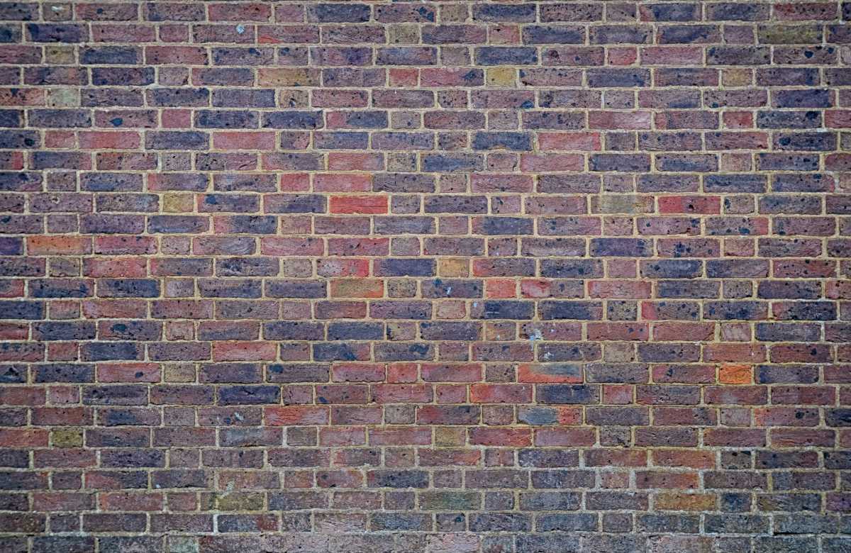 Brick wall with reddish and blackish bricks
