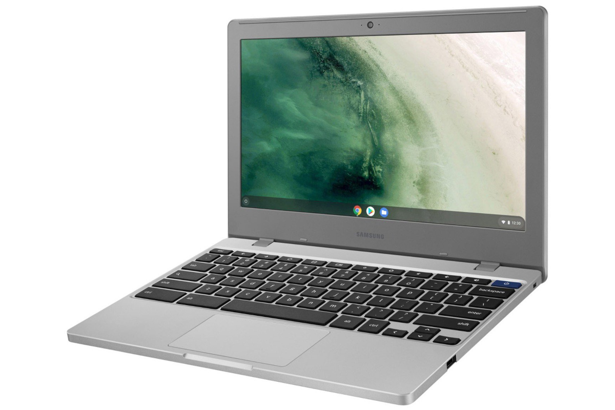 The Samsung Chromebook 4 with a beach scene wallpaper facing from the right.