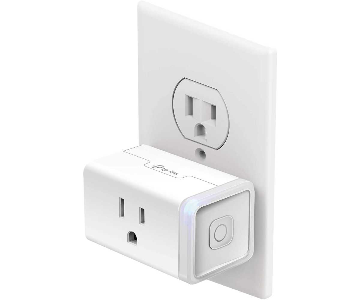 Tp-Link Kasa Smart Mini Plug Plugged Into A White Power Outlet