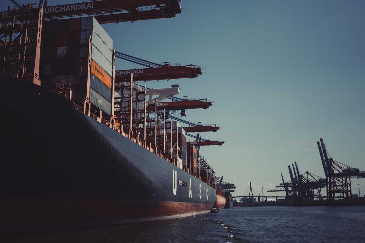 Cargo ship in the water near a port