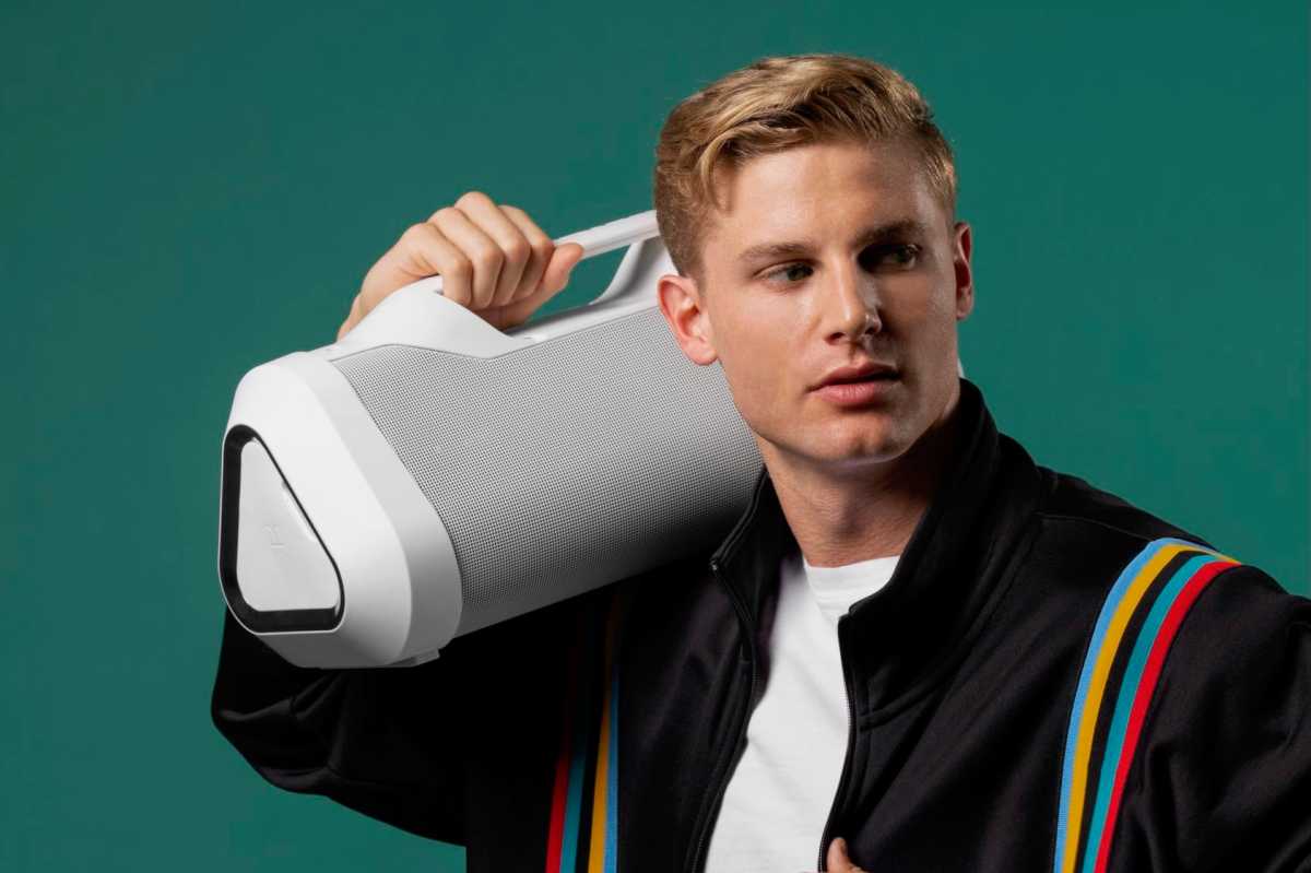 Monster Blaster 3.0 speaker hoisted on a shoulder.