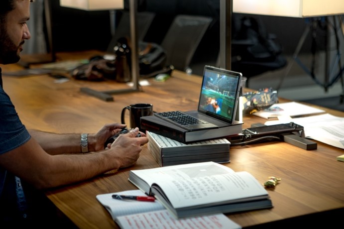 Man playing games on Mac Computer