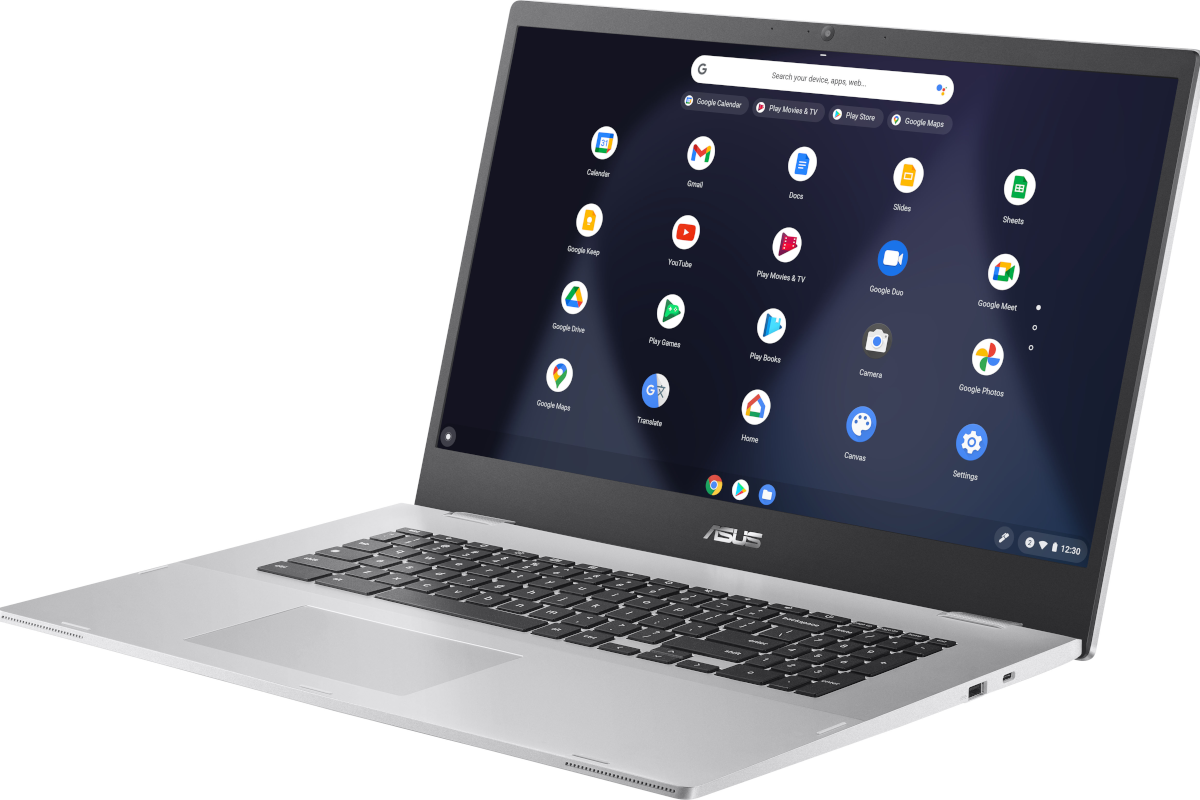 A silver Asus Chromebook facing from right displaying the Chrome OS app grid