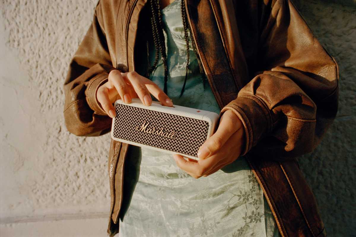 Model holding the Emberteon II Bluetooth speaker