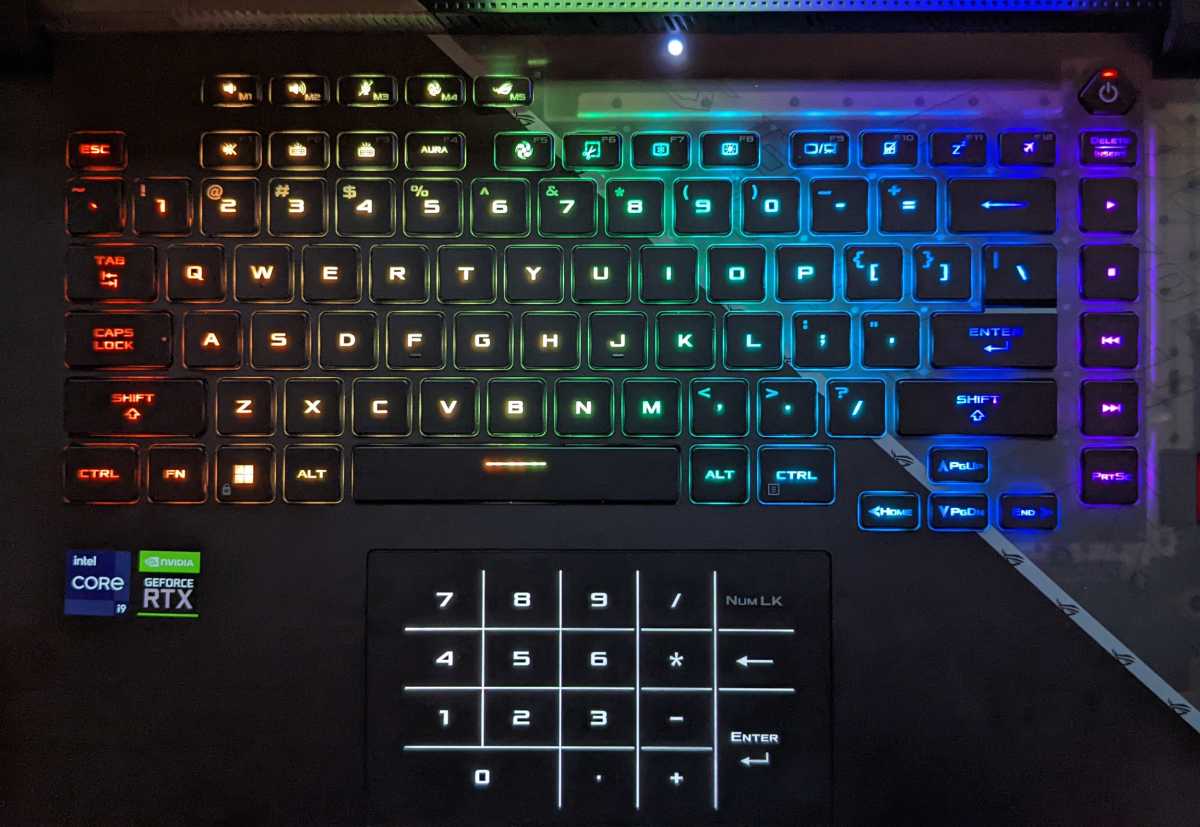Asus Strix Scar 15 keyboard and trackpad, illuminated in rainbow colors