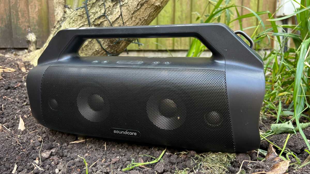 Soundcore Motion Boom Plus sitting in the grass