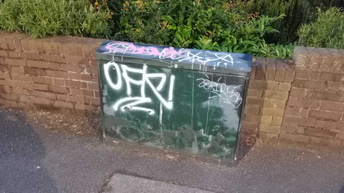 A graffitied street cabinet