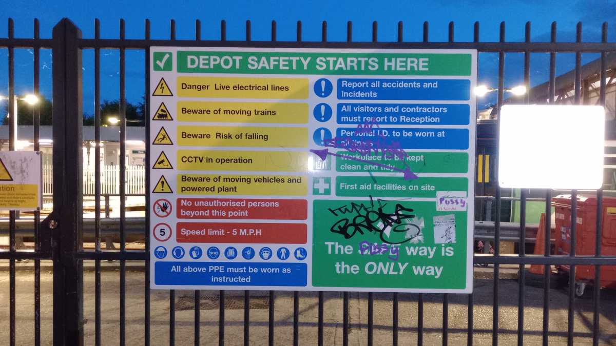 A safety sign on the side of a depot