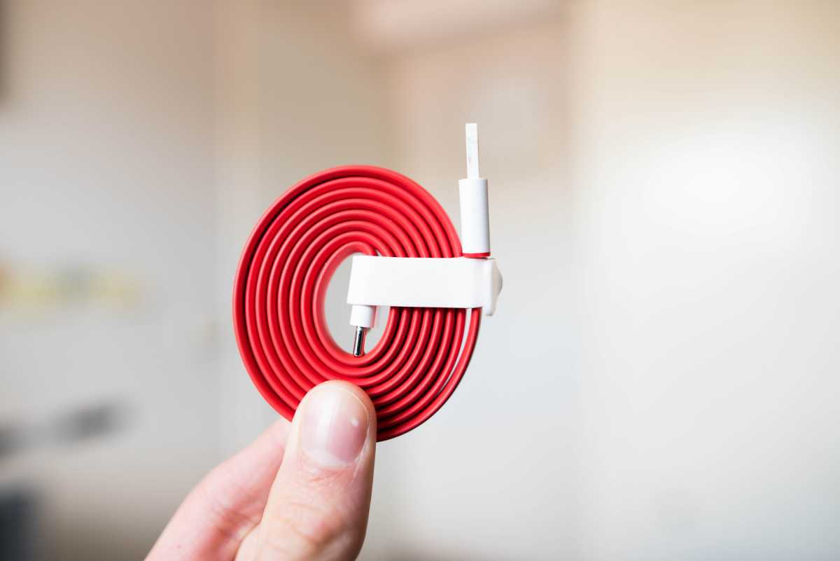 Coiled red-and-white USB-C to USB-A cable