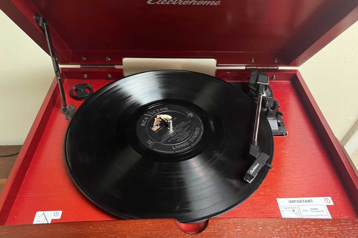 Kingston 7-in-1 turntable playing a record