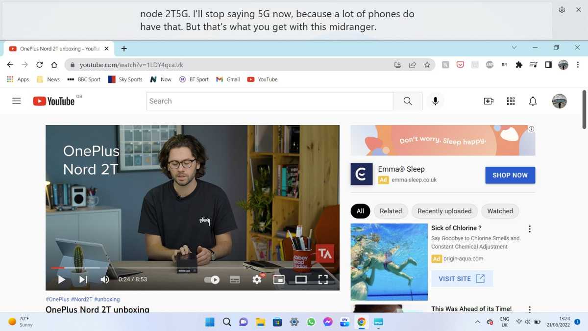 Windows 11 Live Captions displayed above a Tech Advisor YouTube video