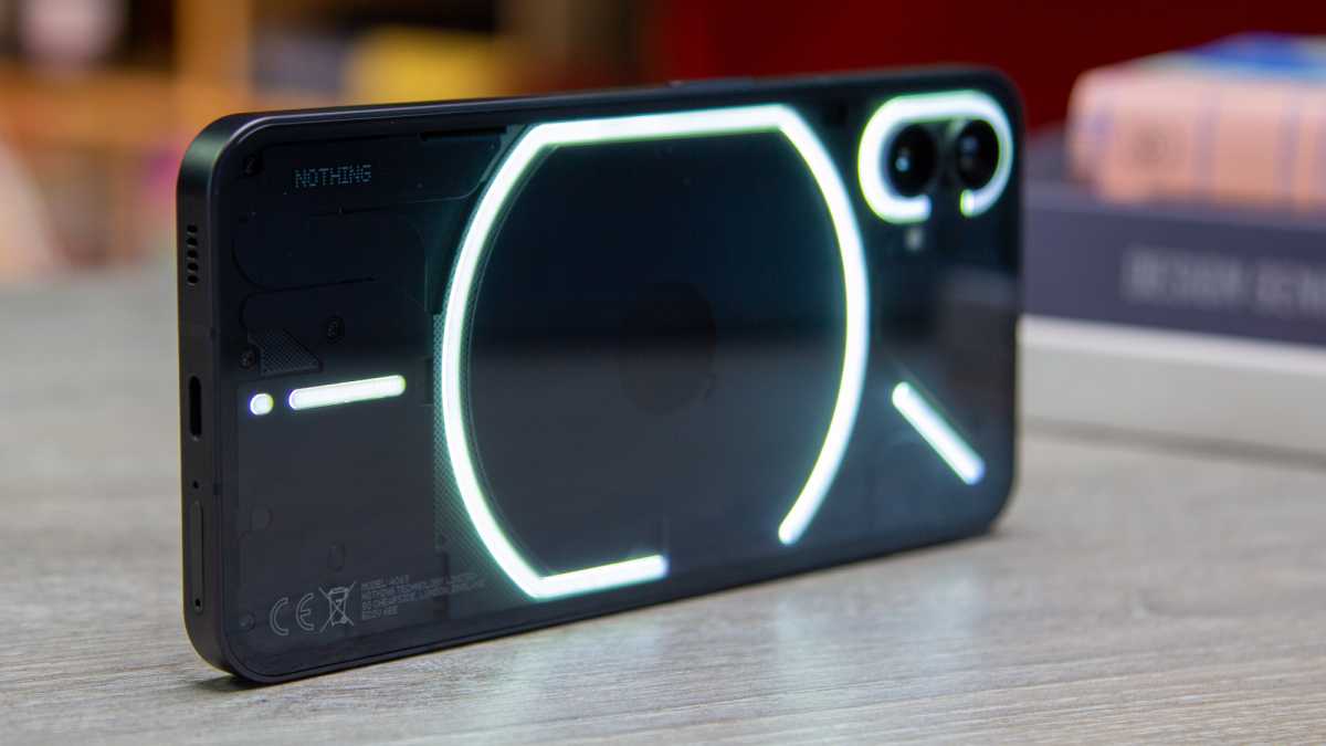 Nothing Phone (1) on its side with lights on