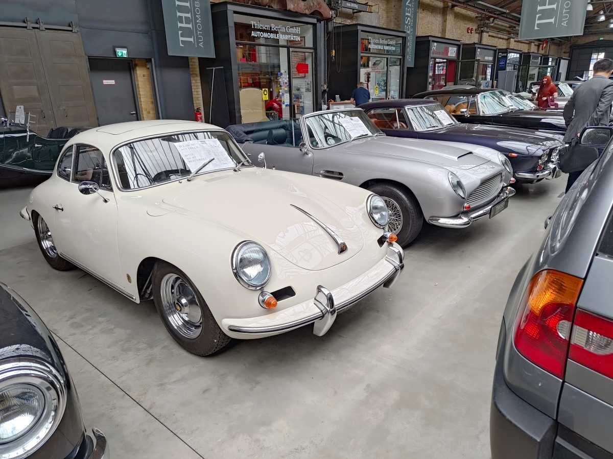 Cream and grey cars from side