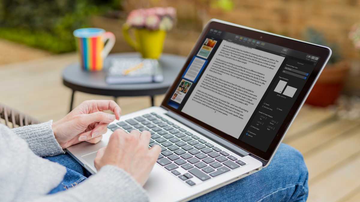 Someone using a laptop on their lap