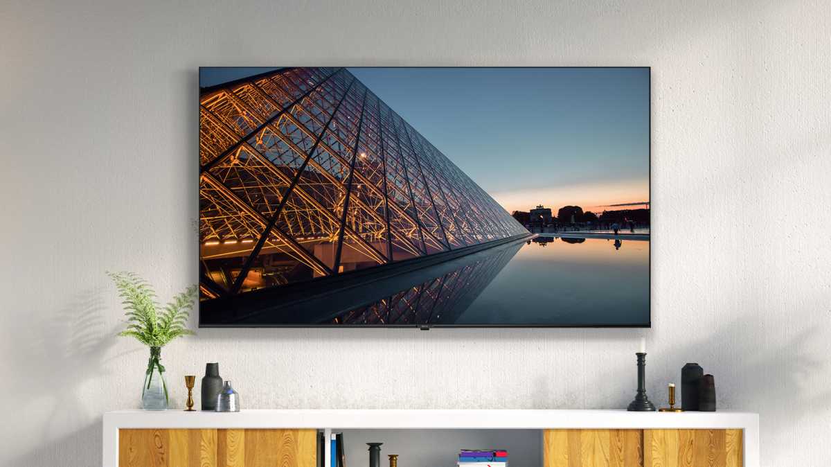 Metz TV in a living room on mounted on a wall