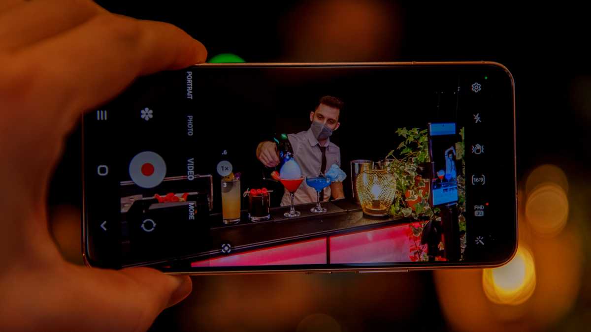 Samsung Galaxy S22 taking a video of a barman