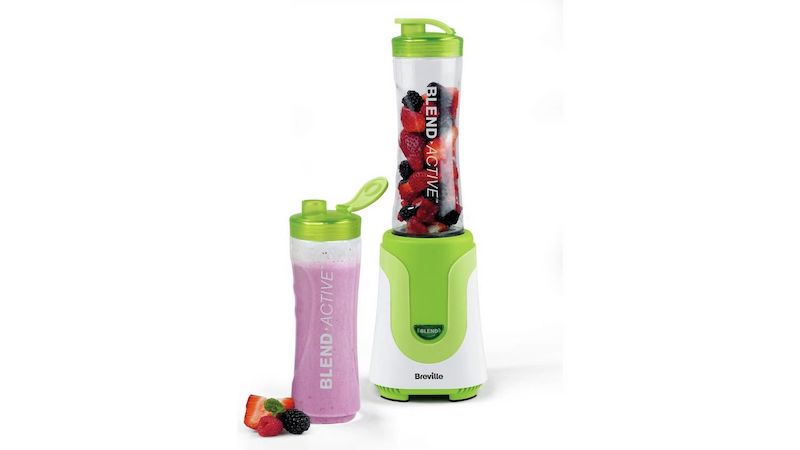 Personal blender in green and white, with to-go bottle