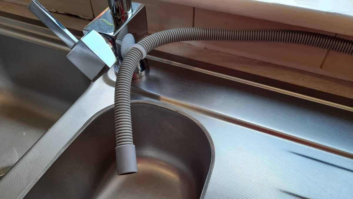 Hava dishwasher hose suctioned to side of sink