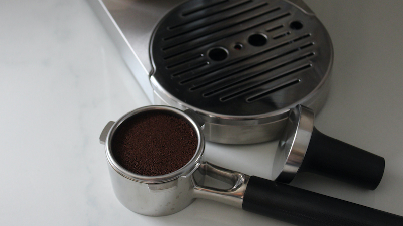The chrome and black portafilter that comes with the KitchenAid espresso machine