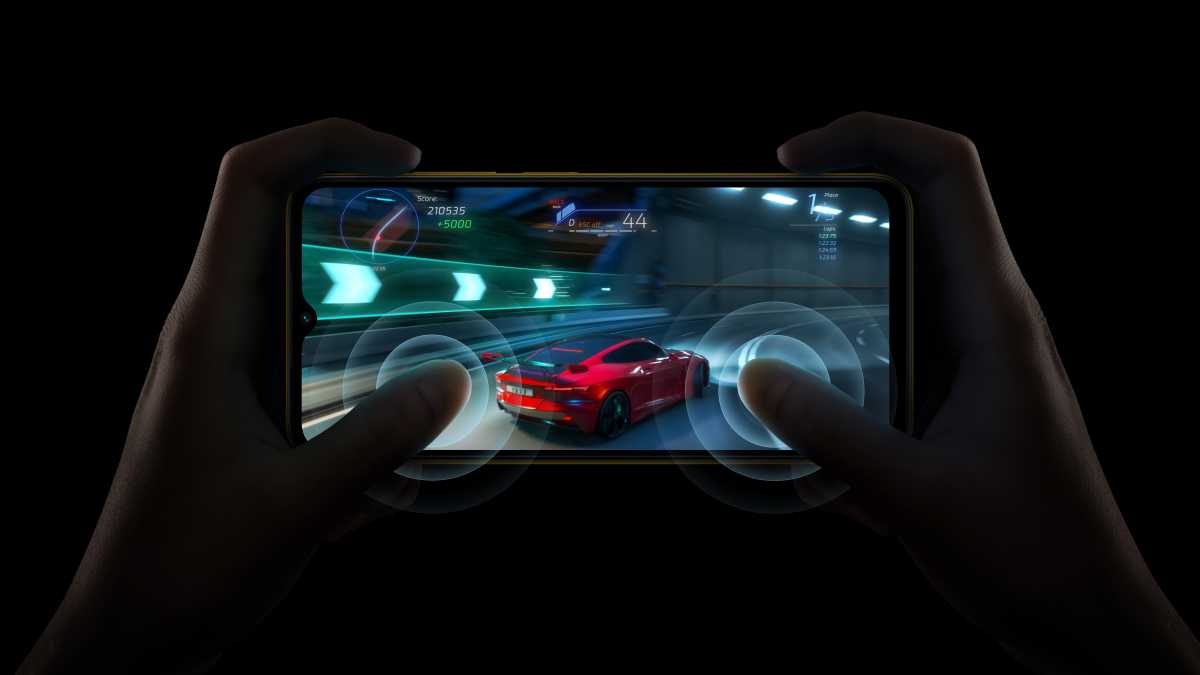 Poco M5 in a dark room gaming