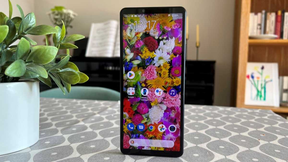 Sony Xperia 10 IV on a table with piano behind