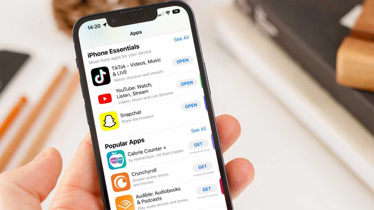 Someone holding an iPhone with the App Store open
