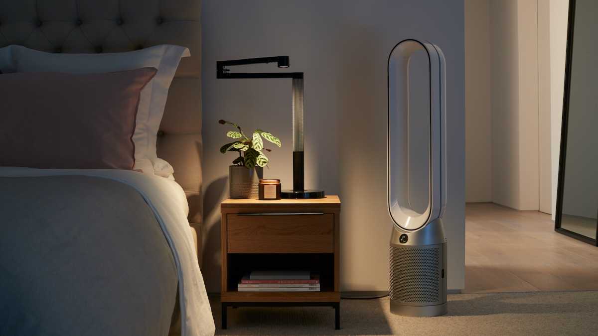 Loop-shaped Dyson air purifier in a bedroom