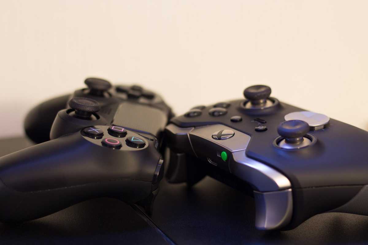 DualShock 4 and Xbox Elite controller on a table