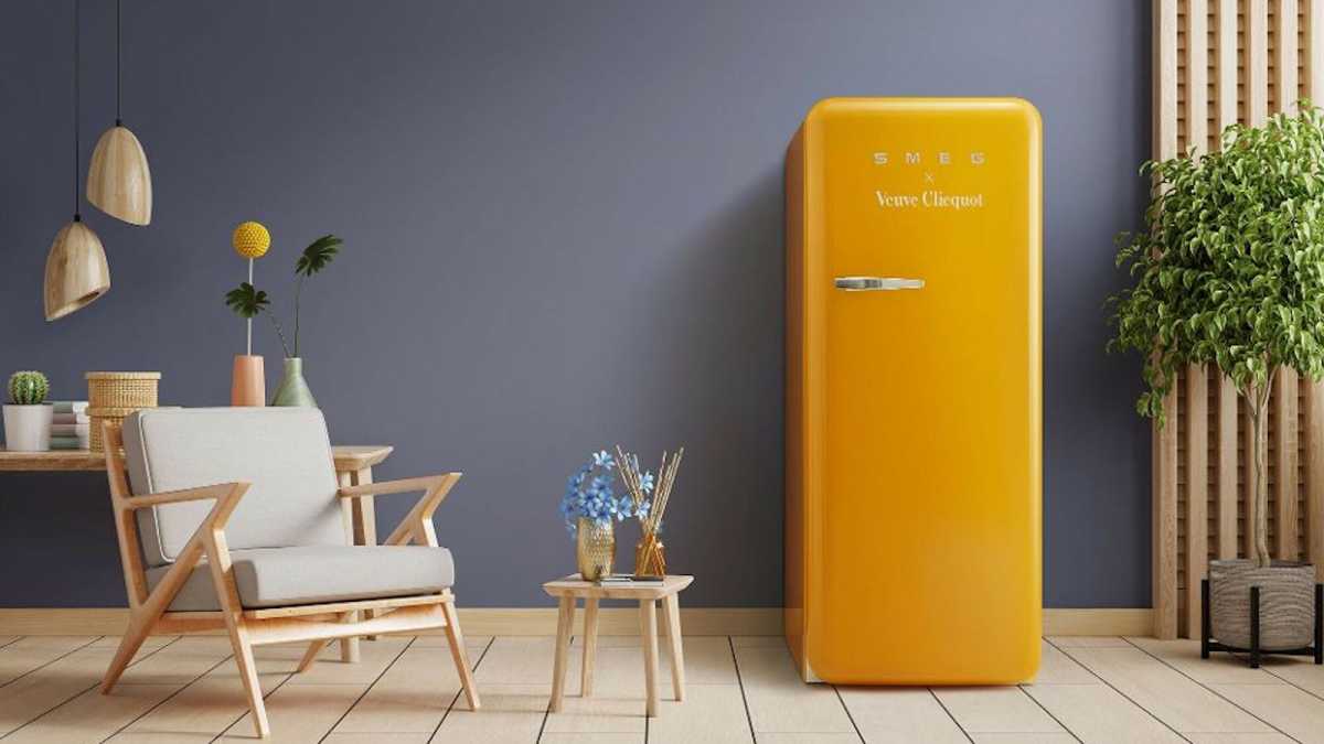 Yellow Smeg x Veuve Clicquot FAB28 co-branded fridge in a sitting room