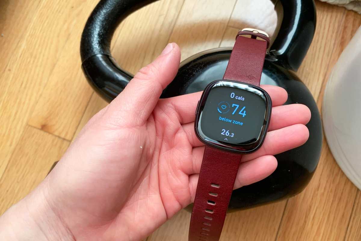 Fitbit Sense 2 held in hand shows manual exercise mode