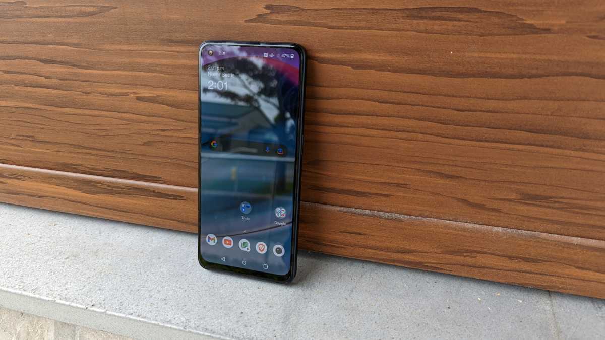 OnePlus Nord N20 5G leaning on a wooden wall