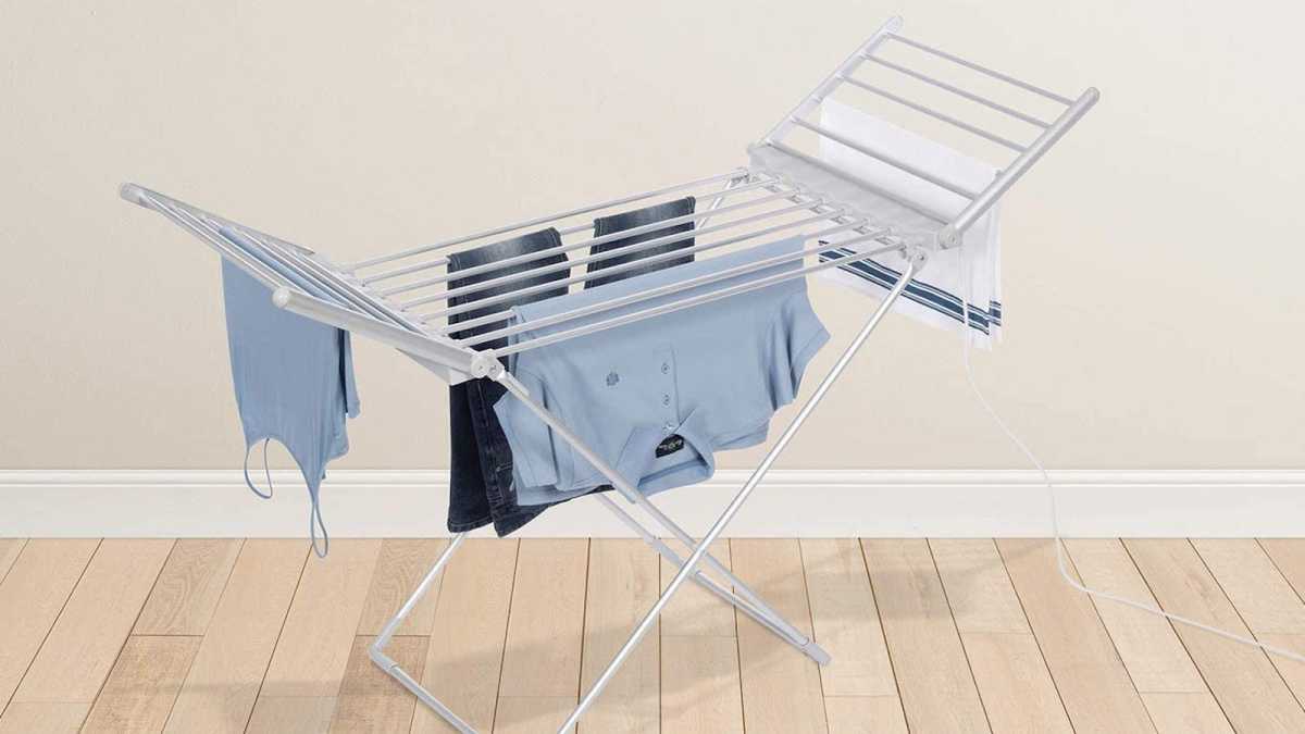 Heated clothes rail with clothes hanging on it
