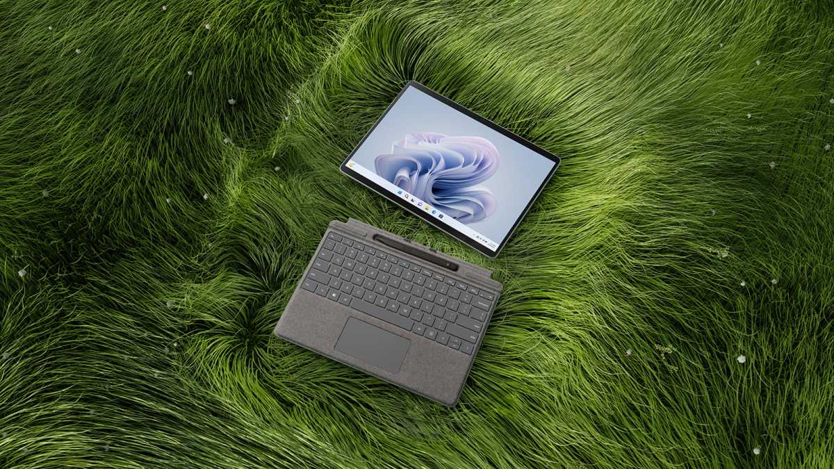 Microsoft Surface Pro 9 - on grass with keyboard and pen