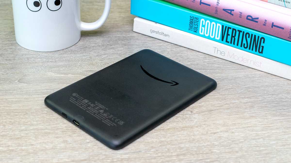 A 2022 Amazon Kindle face down on a table