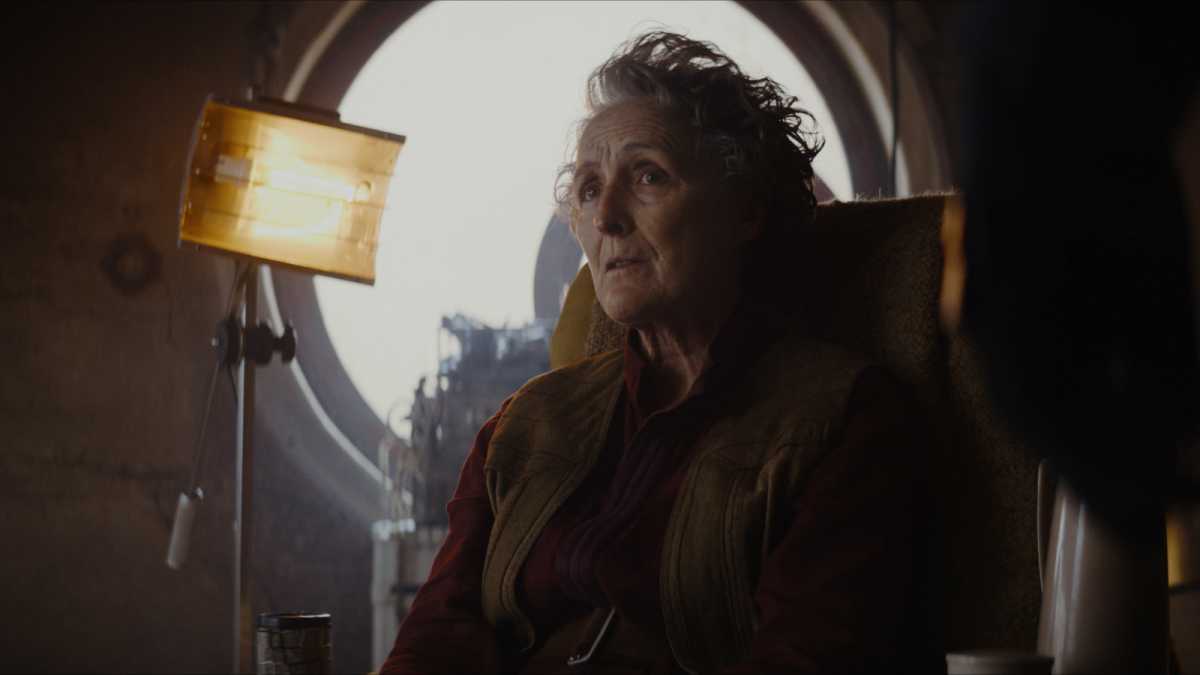Fiona Shaw as Maarva Andor in Andor, sitting in a chair