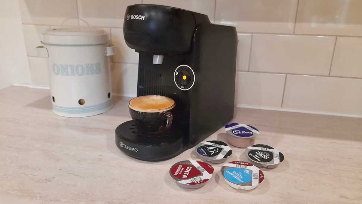 Capsule coffee machine, pictured with T Disc pods and a kitchen container