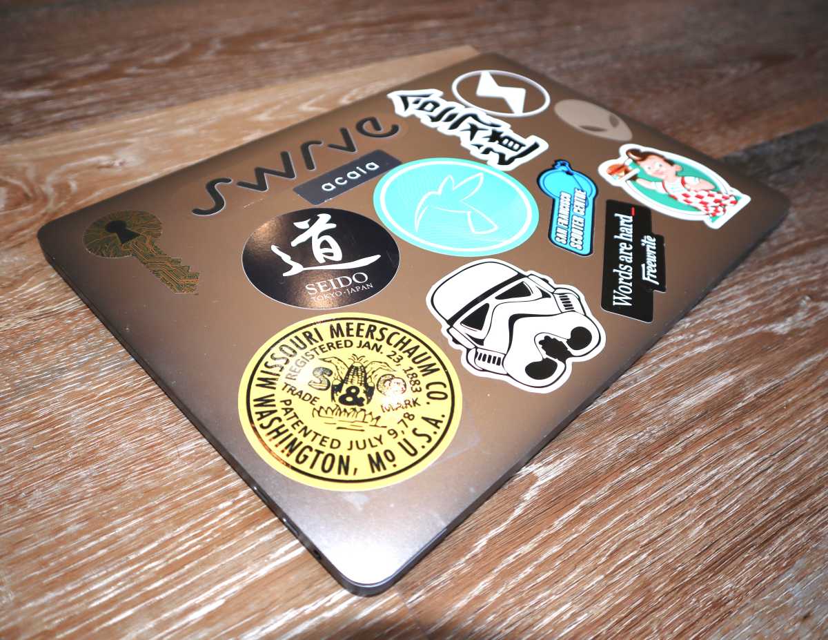 MacBook Pro covered with stickers
