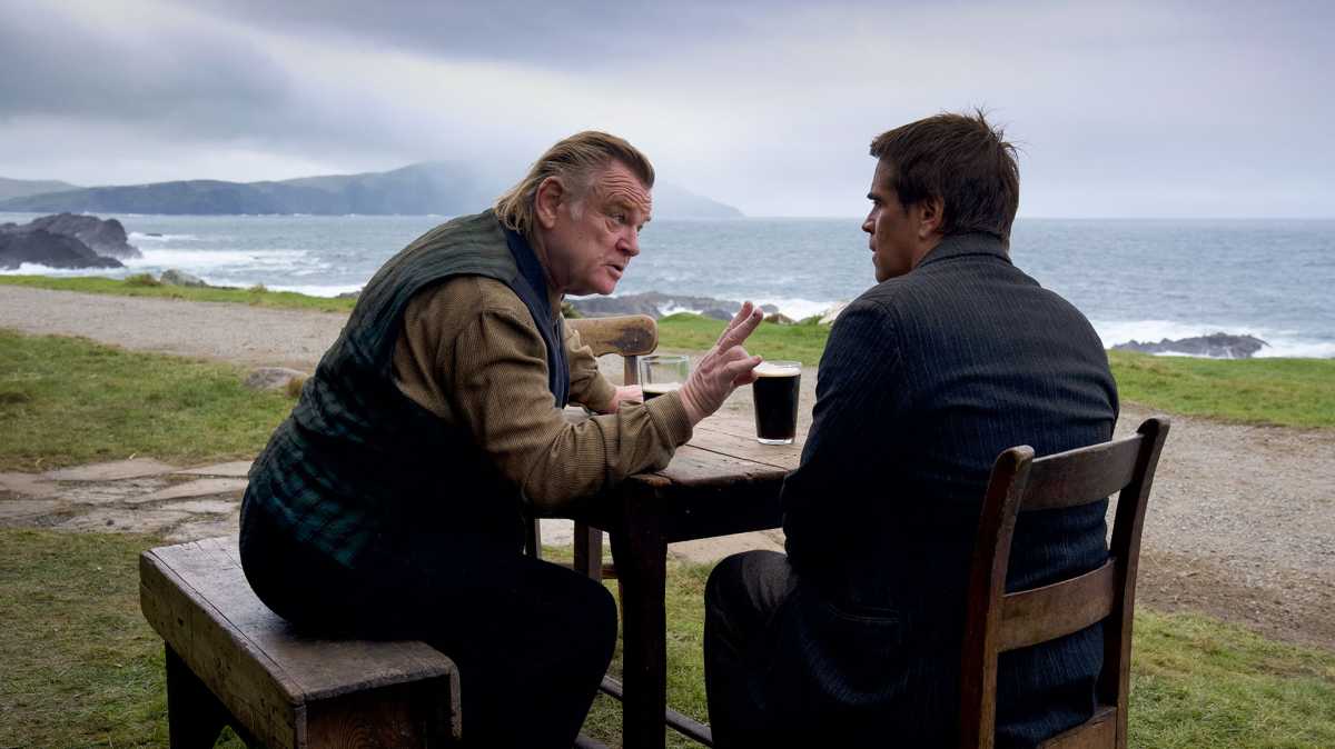 How to watch the 2023 Oscar-nominated Best Picture films 3 The Banshees of Inisherin - Colin Farrell and Brendan Gleeson sat at a table drinking Guiness on a beach