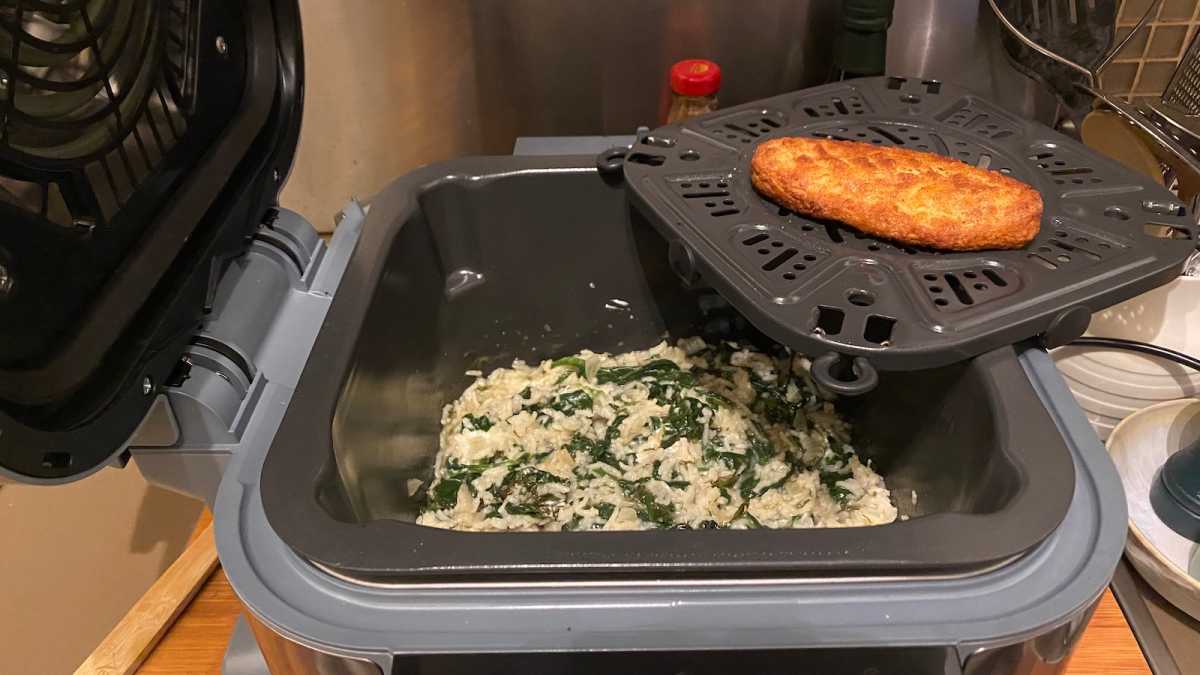 Rice dish steamed in the bottom half of the cooker, and a fillet air friend on top