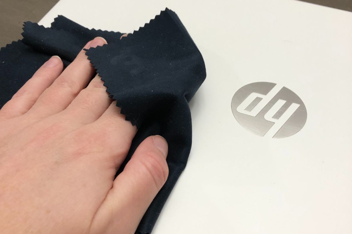 Wipe the laptop down with a microfiber cloth