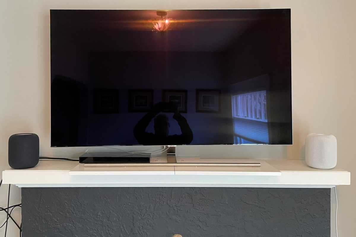 Apple HomePod 2nd Gen next to flat-screen TV