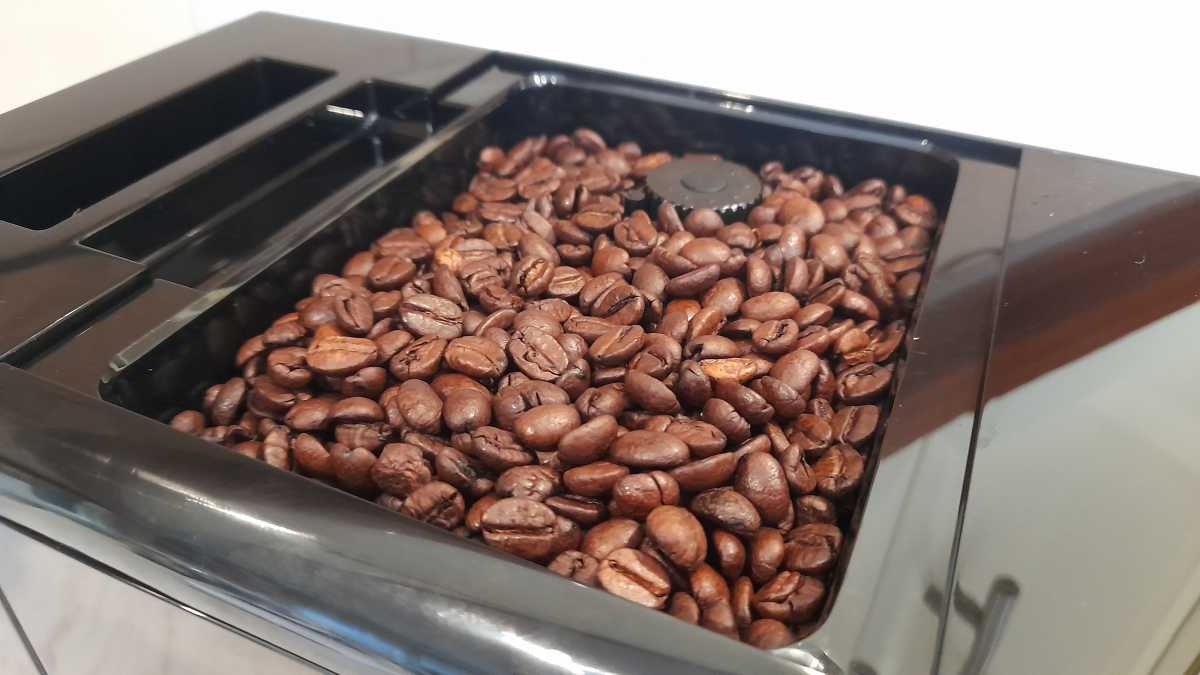A close up of the Beko Bean to Cup bean funnel with coffee beans.