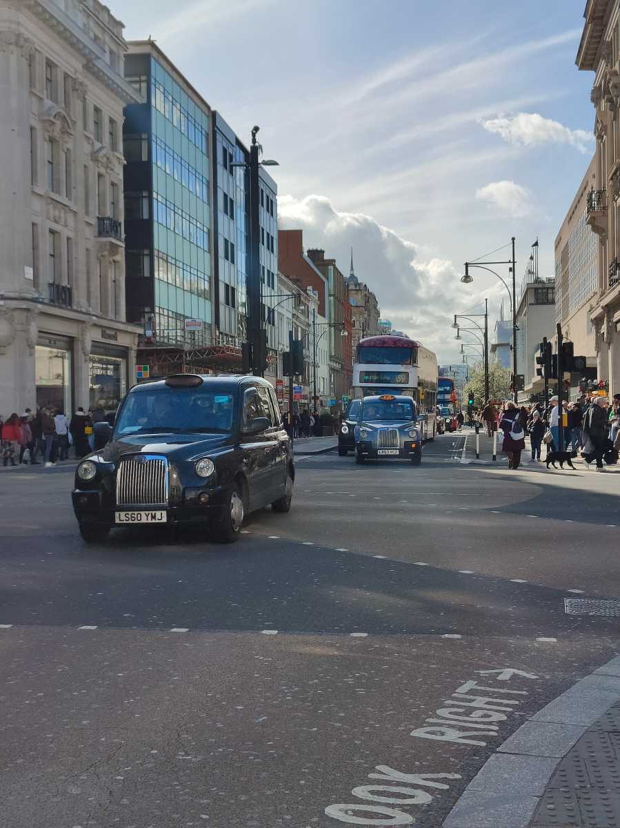 Oxford Street with London taxis driving by