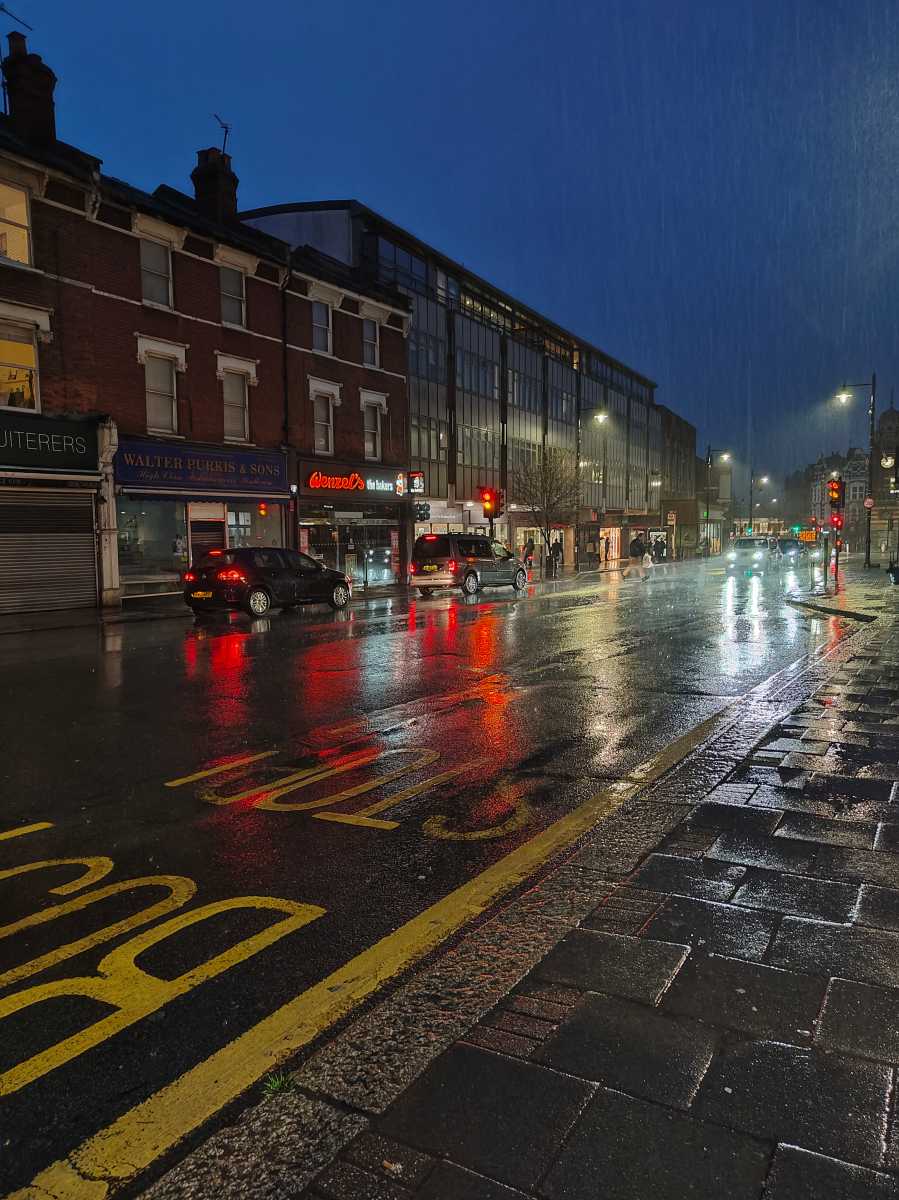 High street raining at night