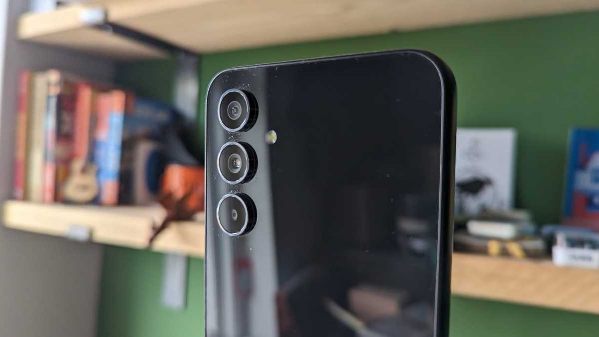Samsung Galaxy A54 cameras in front of a shelf