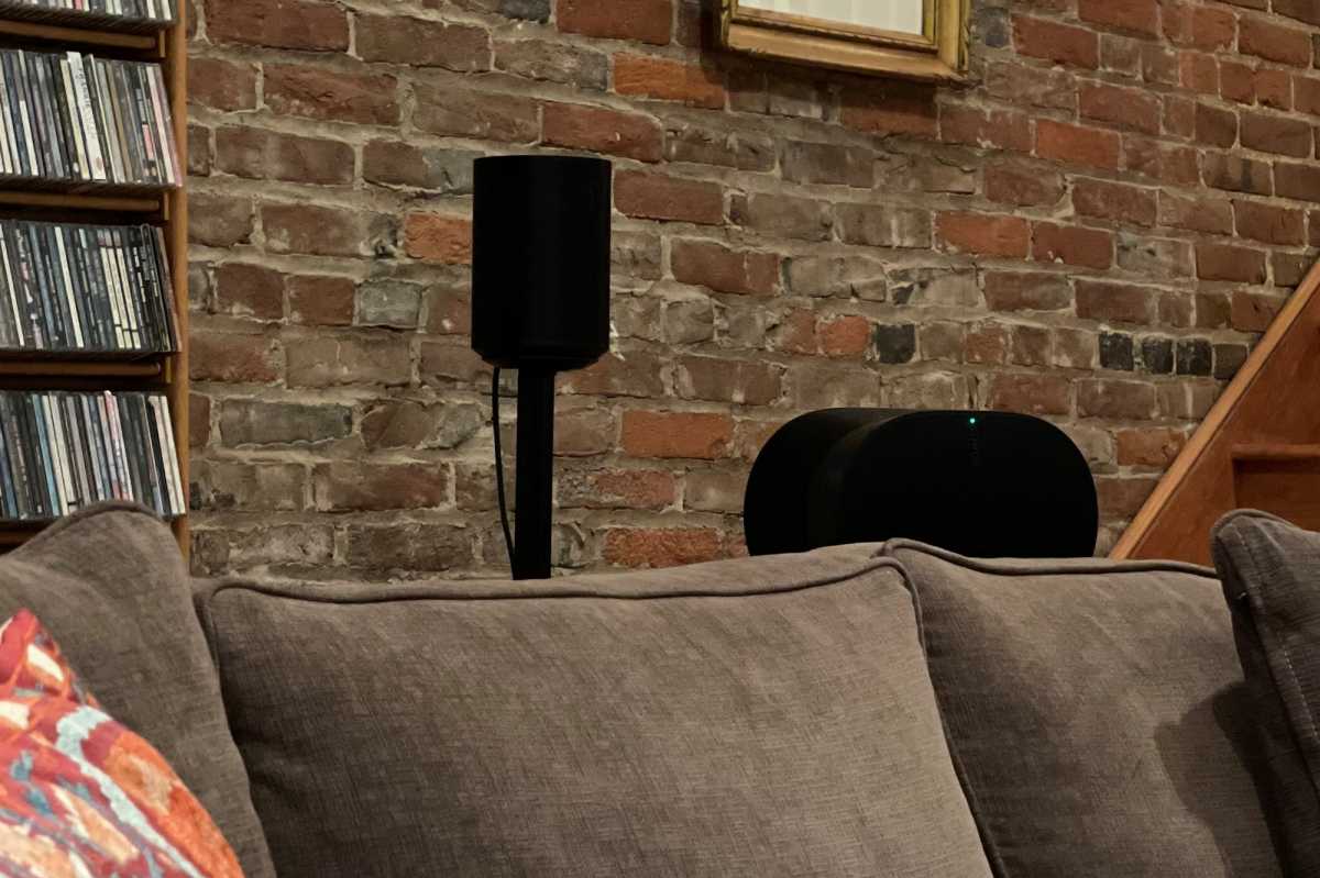 Sanus stands for Sonos Era behind sofa