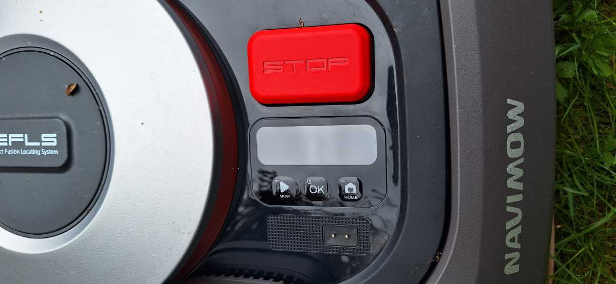 Close up of Segway Navimow LCD screen and stop button