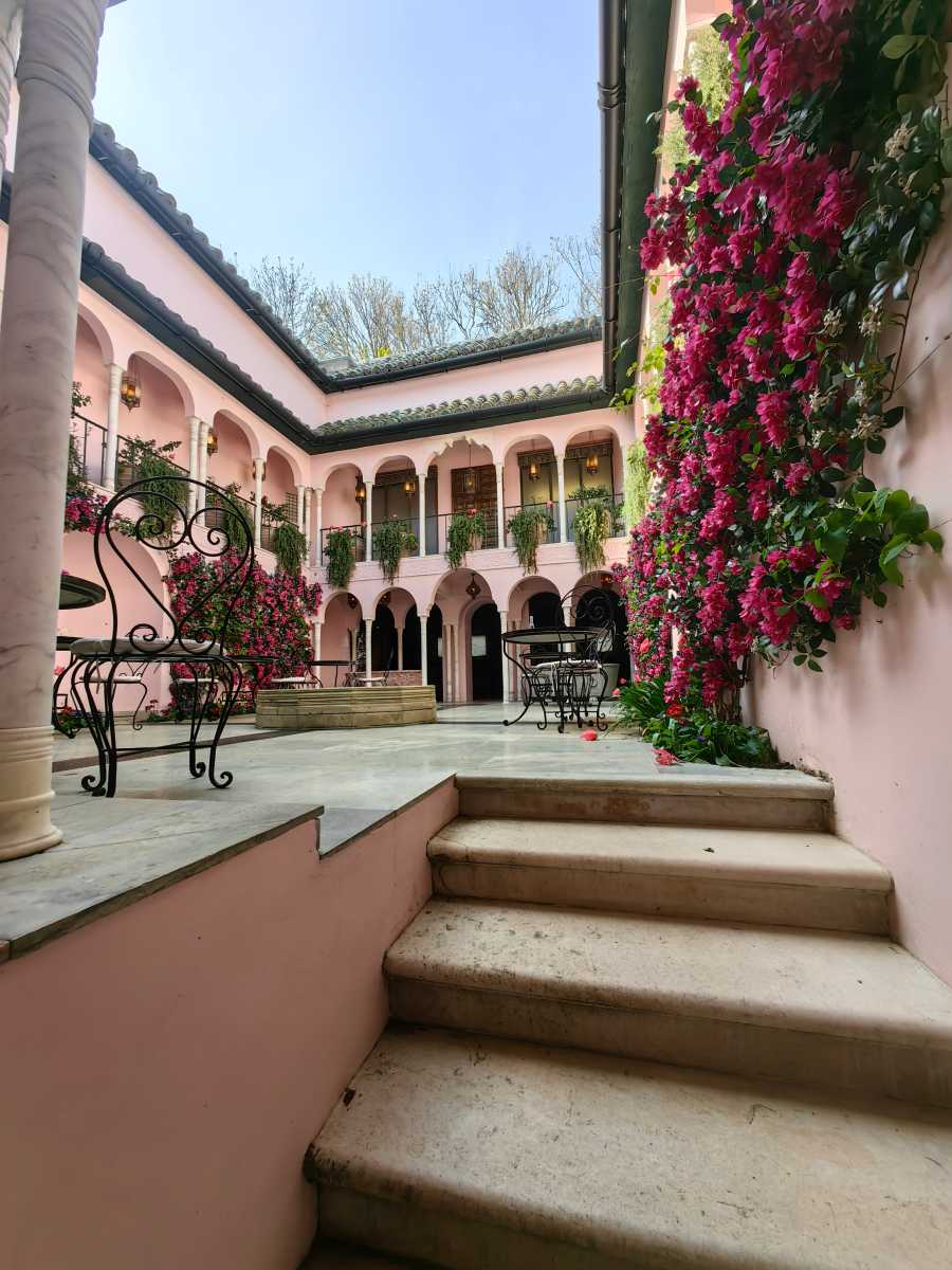 Wide-angle shot of pink courtyard