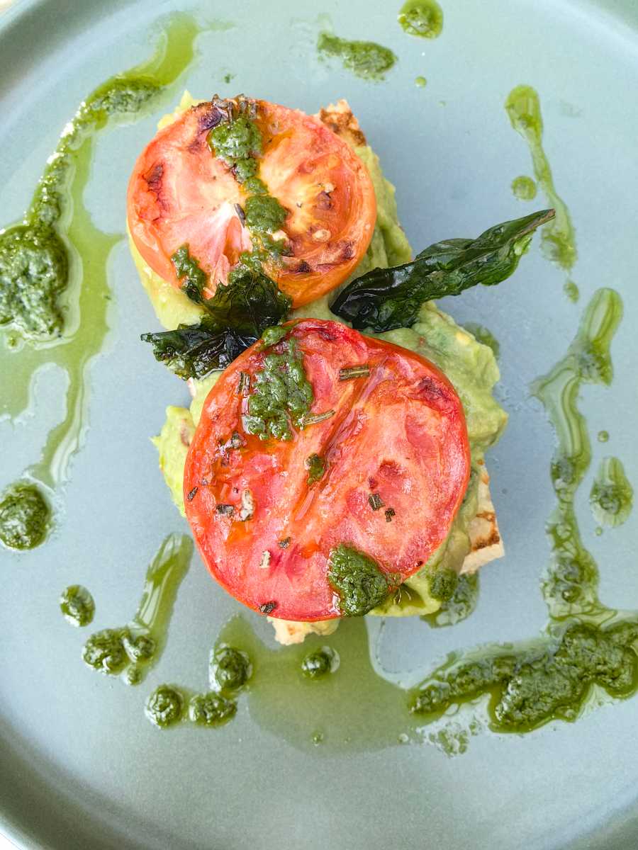 Avocado on focaccia with tomatoes 