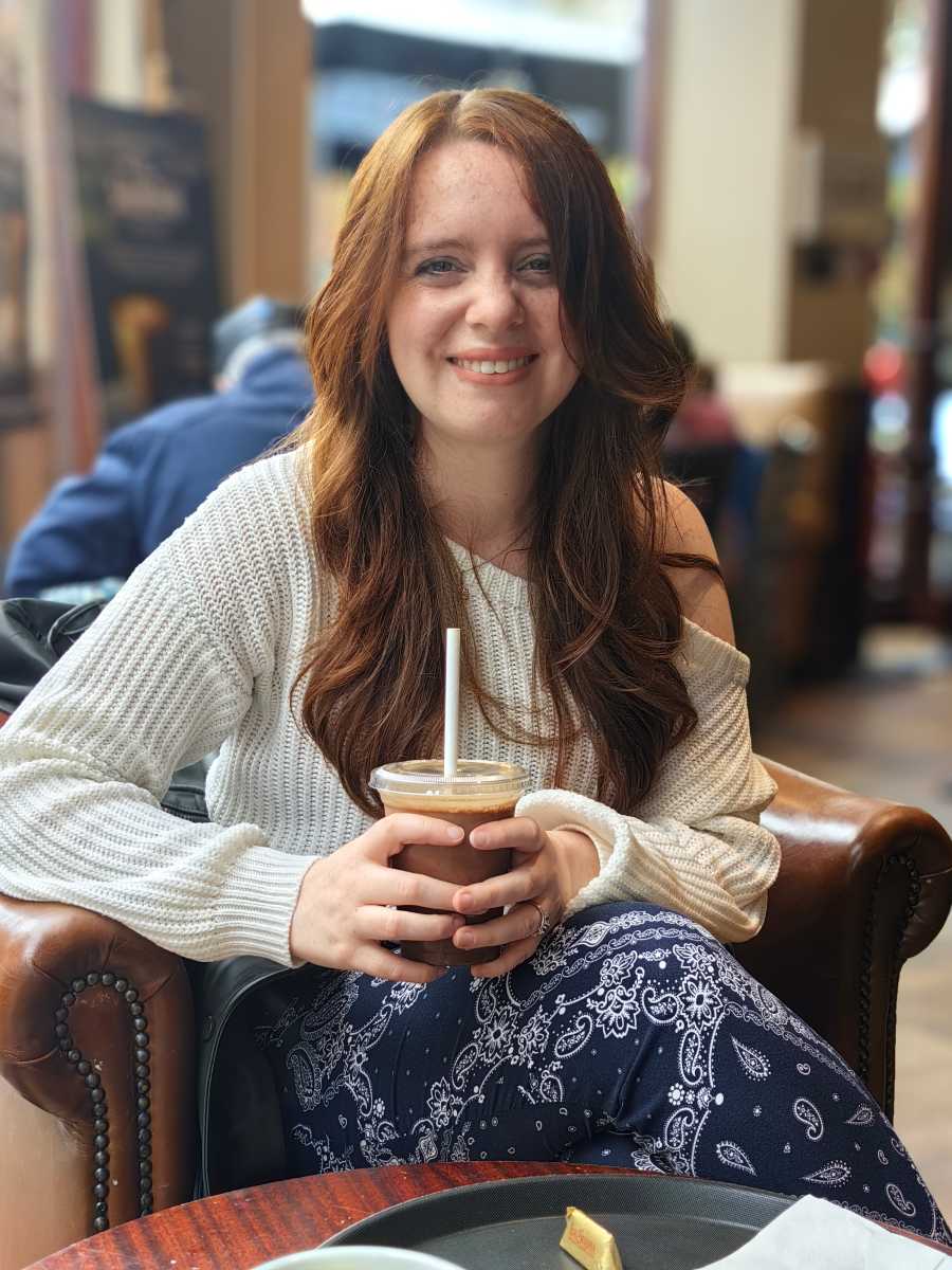 Woman in coffee shop zoomed in